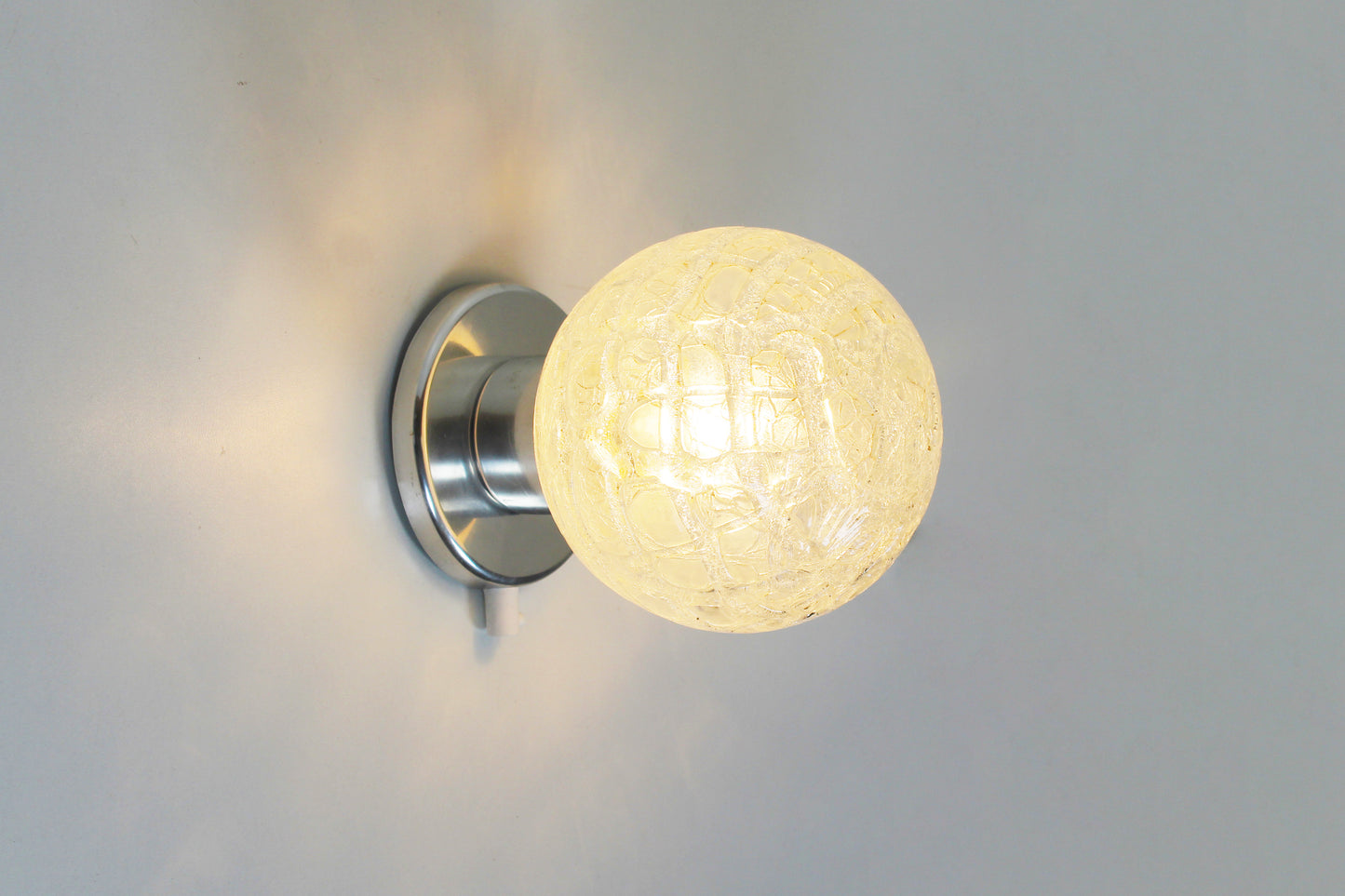 Pair of vintage chrome wall lamps door Doria Leuchten