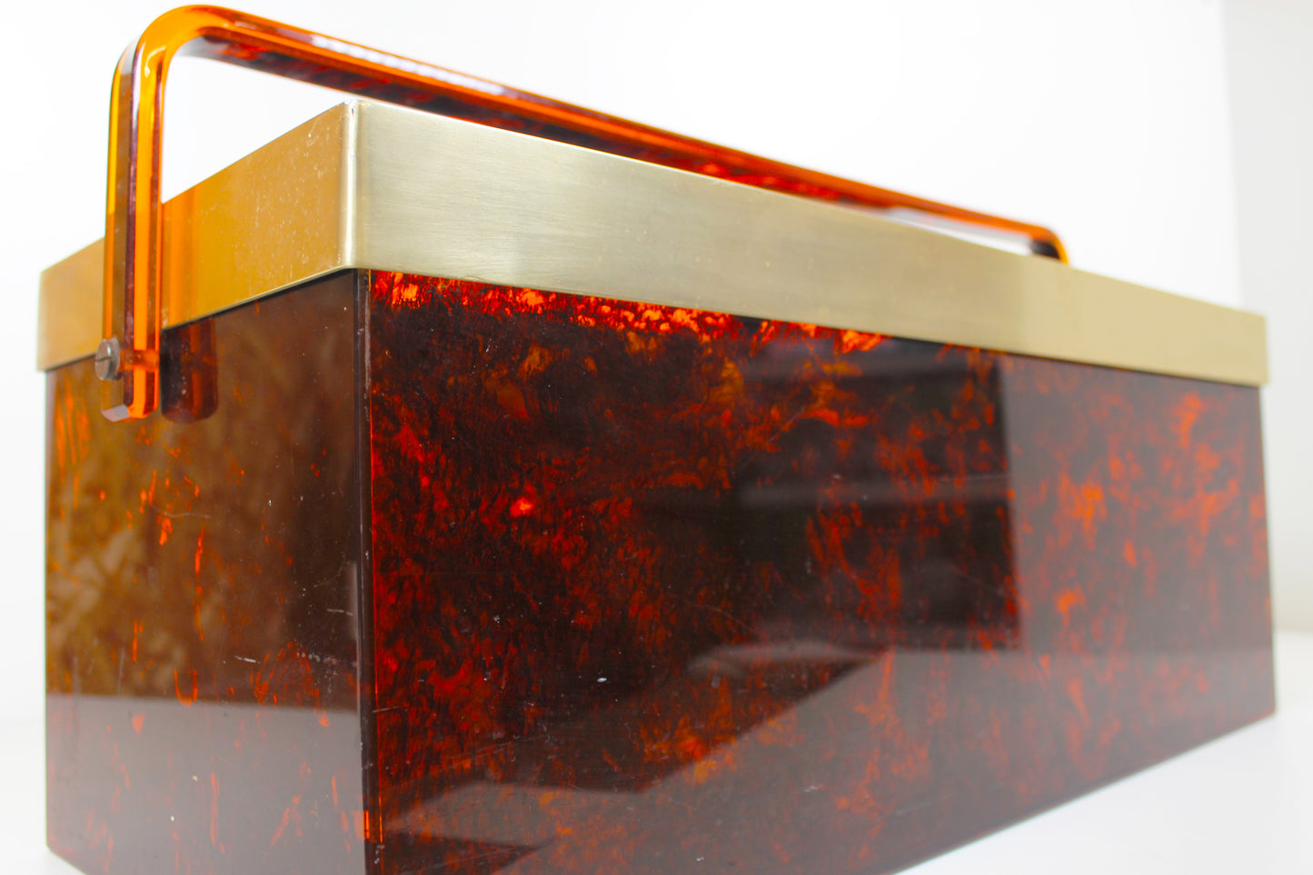 Italian magazine rack in 'faux tortoiseshell' and brass