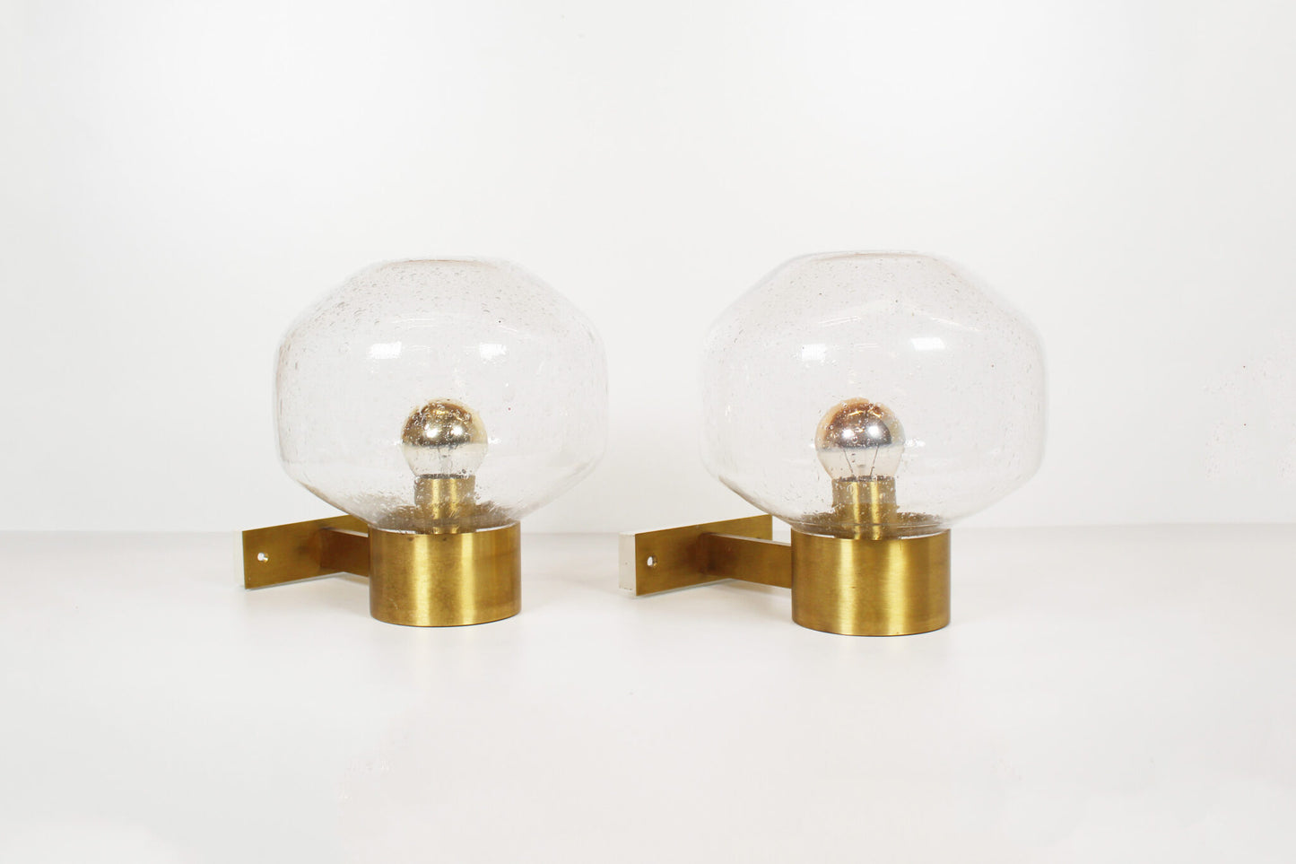 Pair of brass and mouth blown glass wall lights attr. to Doria