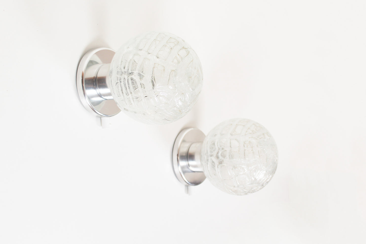Pair of vintage chrome wall lamps door Doria Leuchten