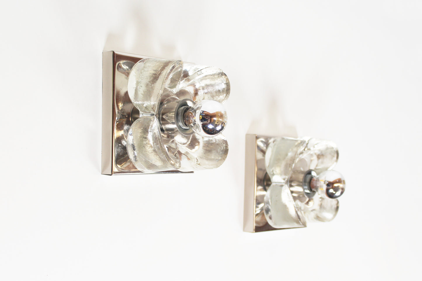 Pair of 1970's polished and glass wall lights by Sische