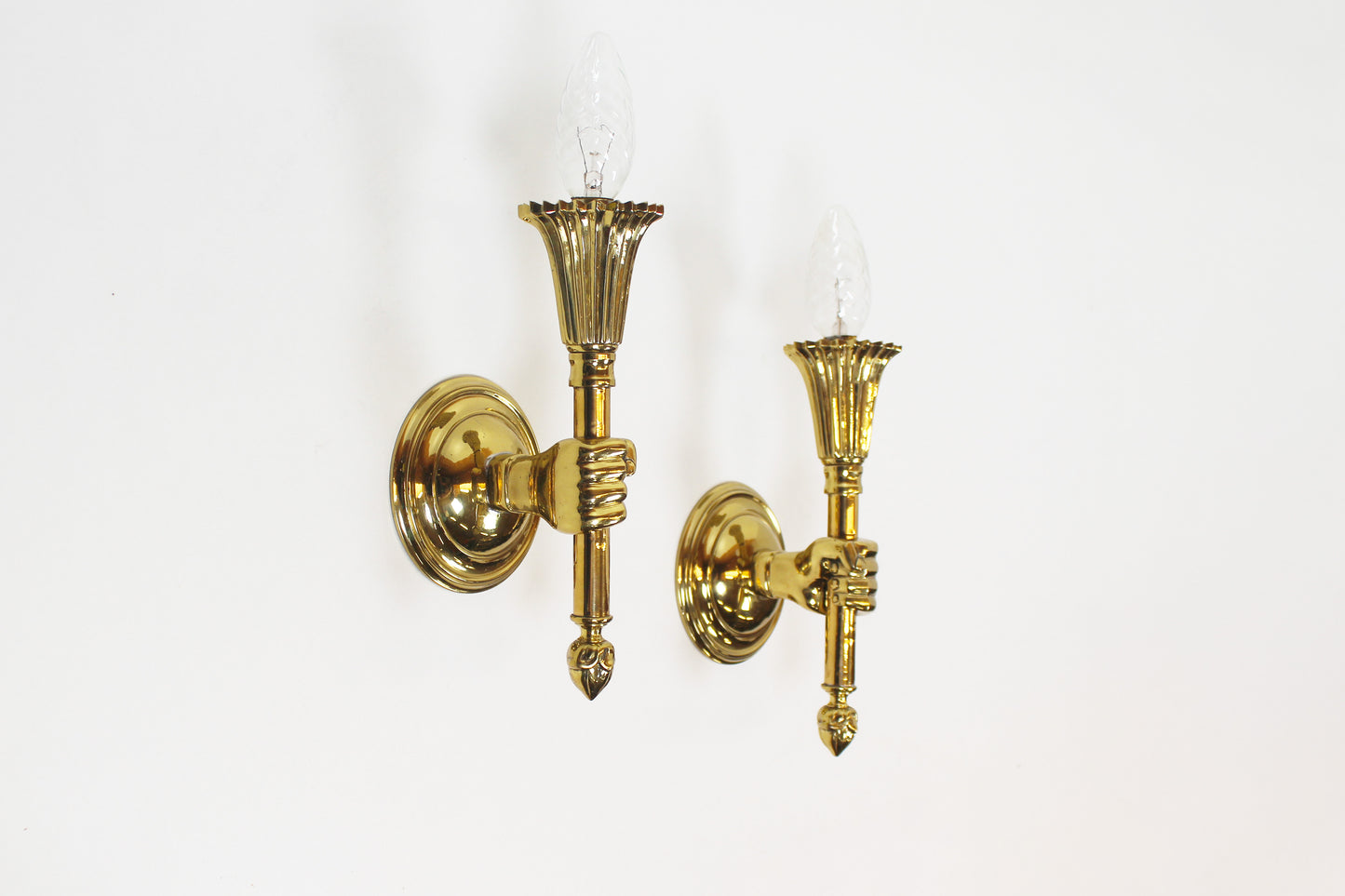 Pair of 'torch' wall lamps in the style of Maison Jansen