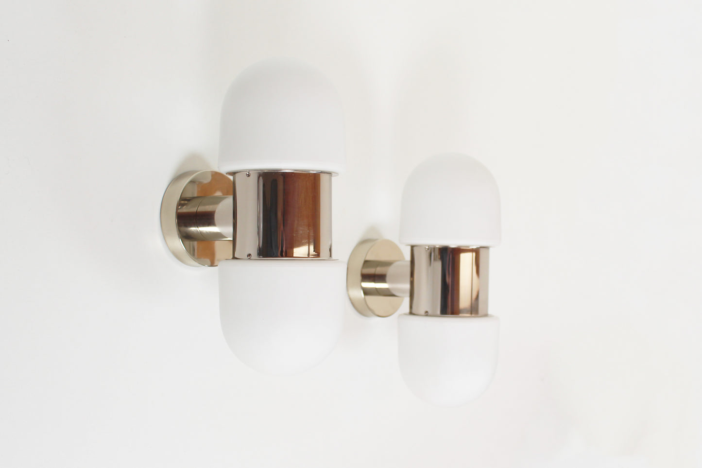 Set of vintage chrome and opaline glass wall lamps by Rolf Kruger