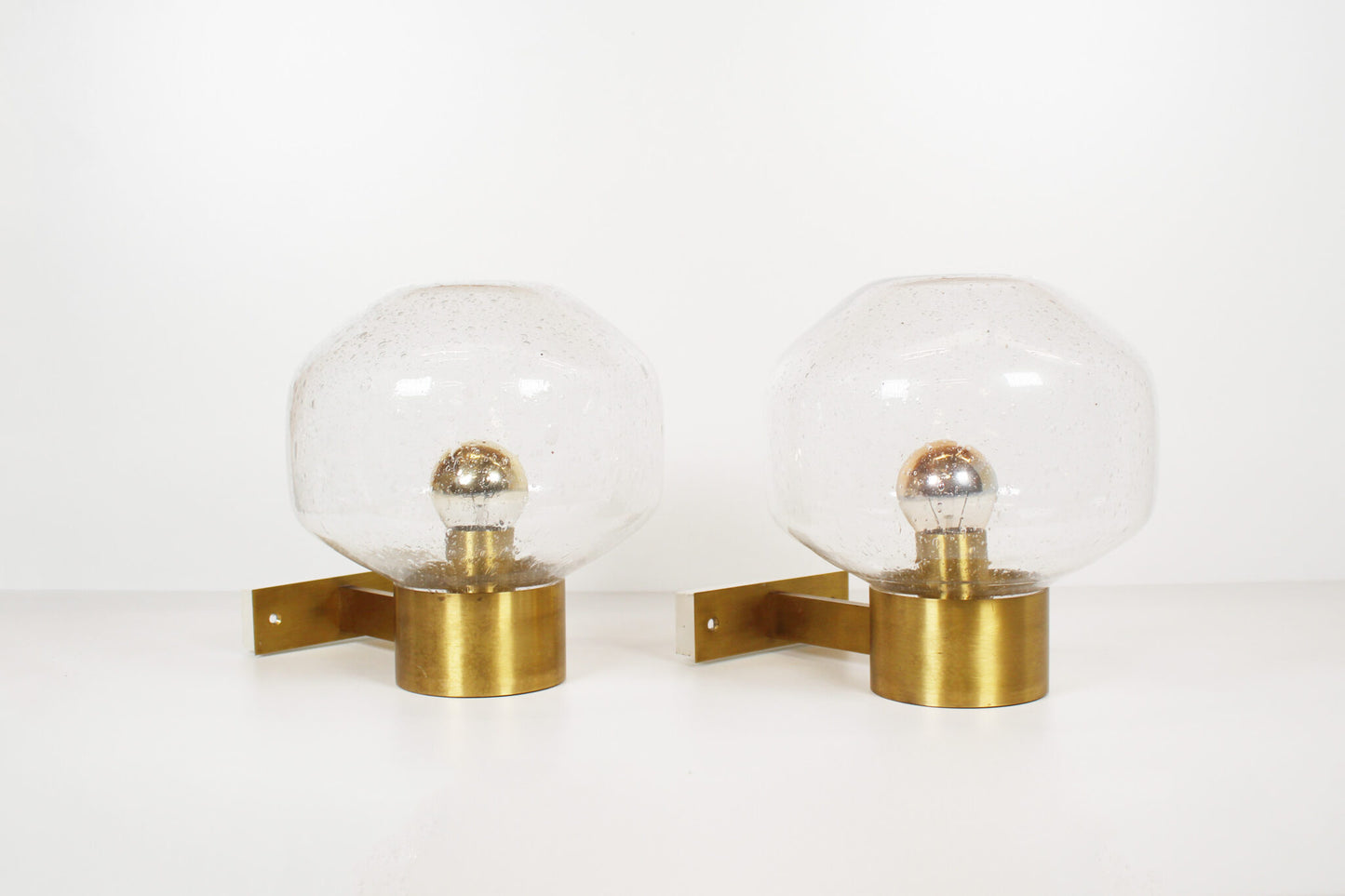 Pair of brass and mouth blown glass wall lights attr. to Doria