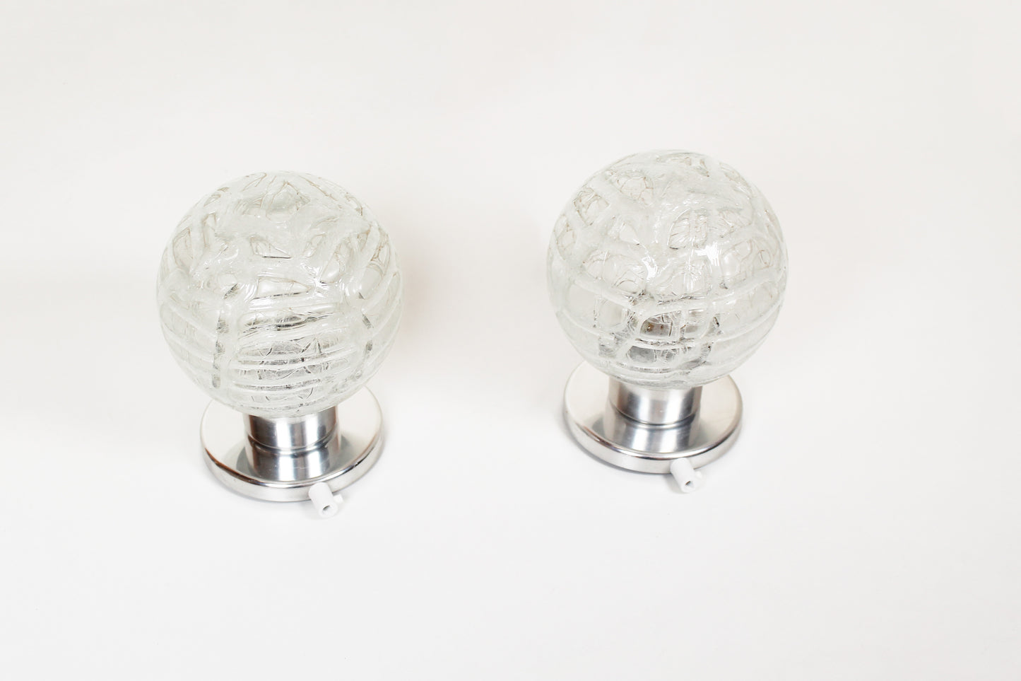 Pair of vintage chrome wall lamps door Doria Leuchten