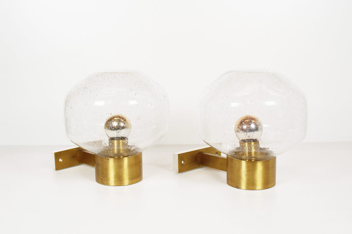 Pair of brass and mouth blown glass wall lights attr. to Doria