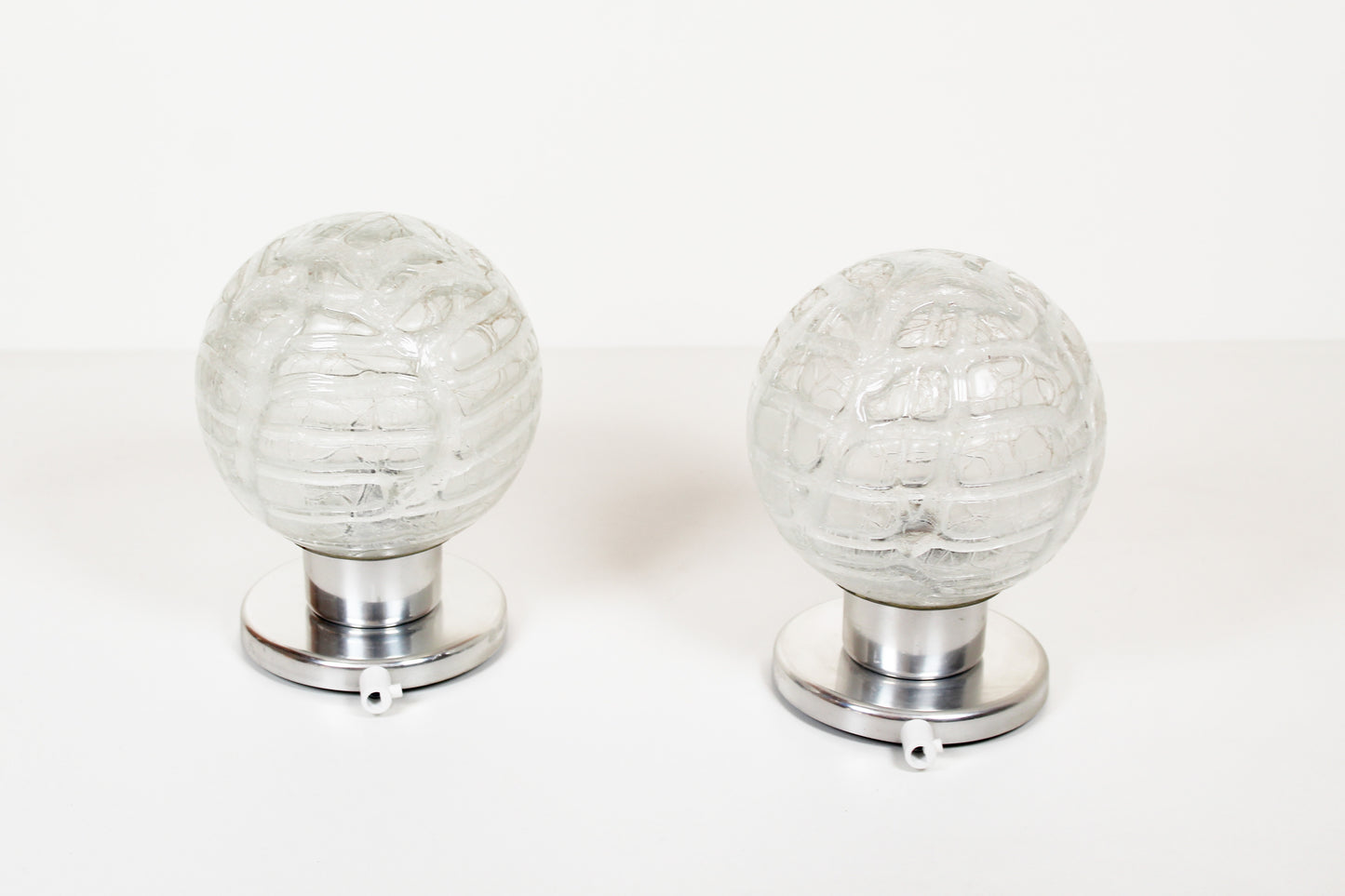 Pair of vintage chrome wall lamps door Doria Leuchten