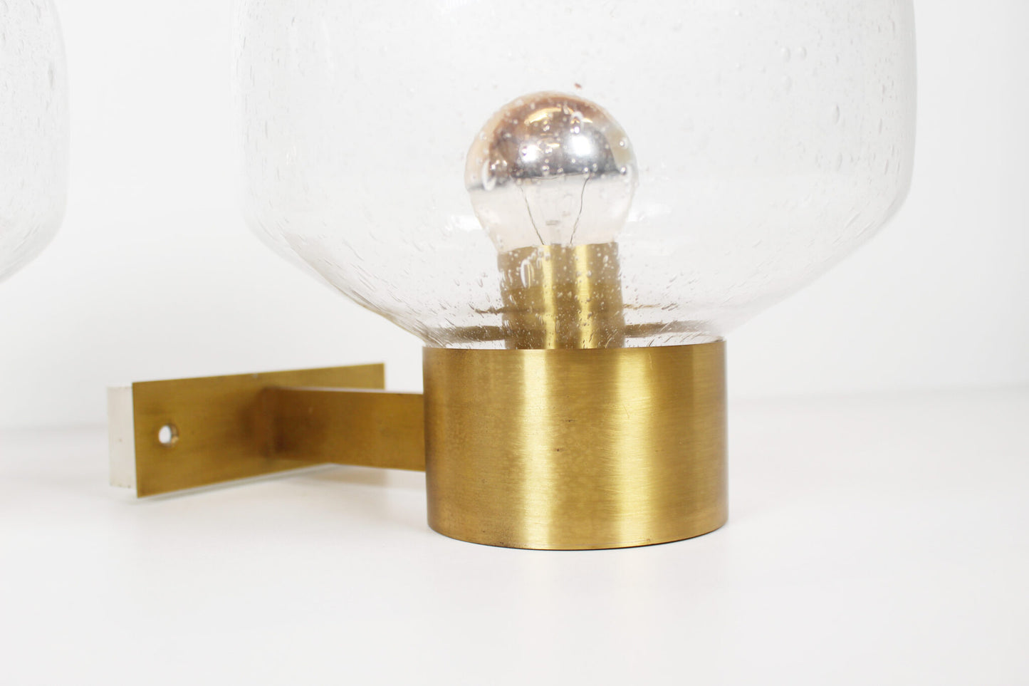 Pair of brass and mouth blown glass wall lights attr. to Doria
