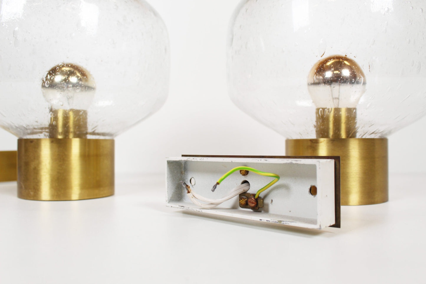 Pair of brass and mouth blown glass wall lights attr. to Doria