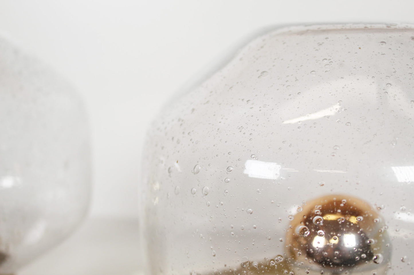 Pair of brass and mouth blown glass wall lights attr. to Doria