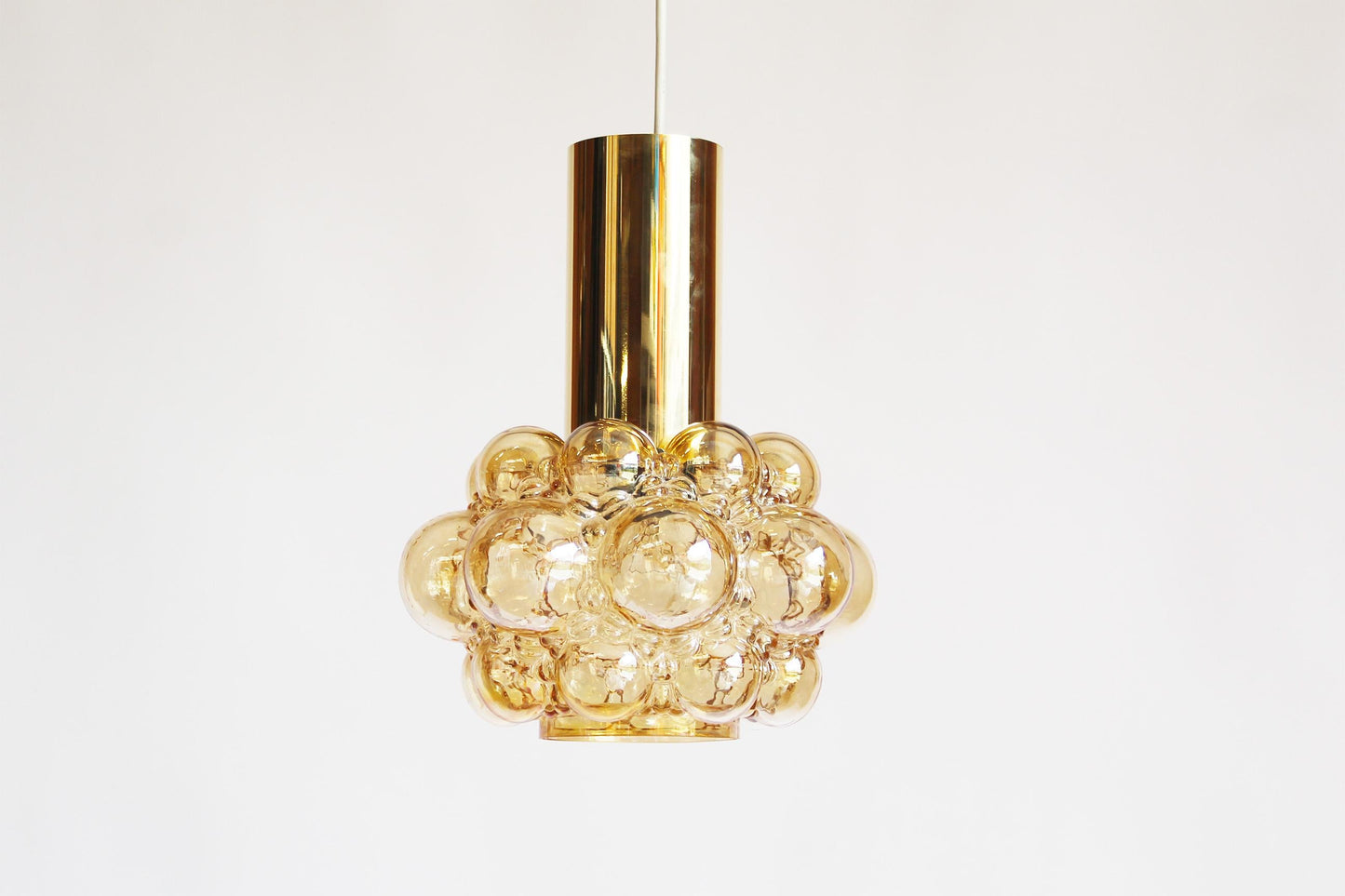 Amber glass pendant lamp by Helena Tynell for Glashutte Limburg