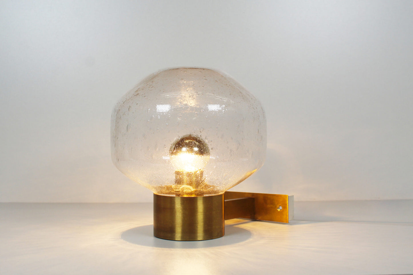 Pair of brass and mouth blown glass wall lights attr. to Doria