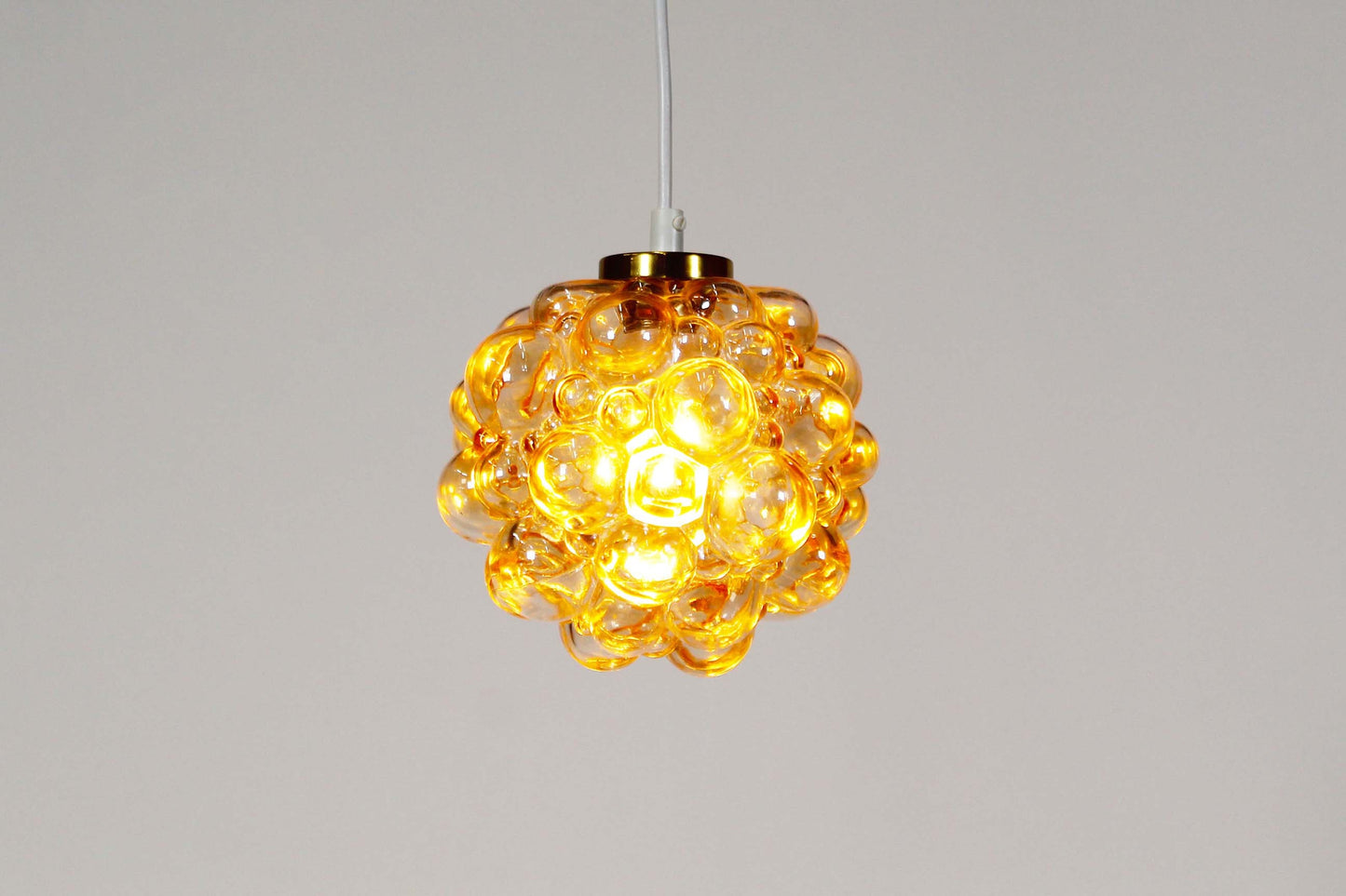 Amber glass 'bubble' pendant lamp by Helena Tynell for Glashutte Limburg