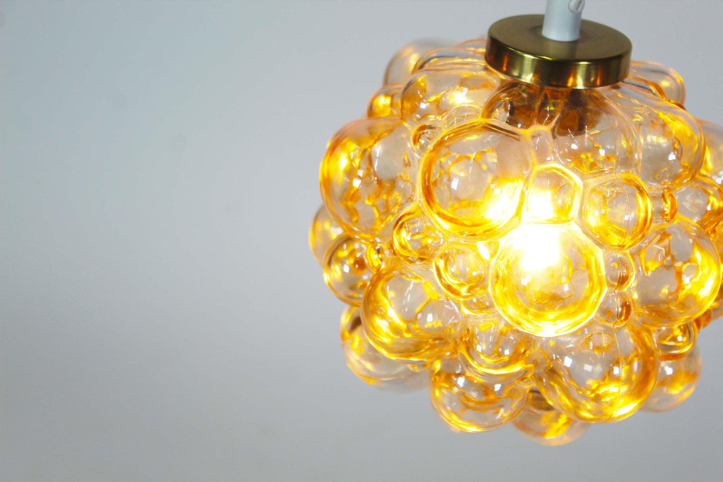 Amber glass 'bubble' pendant lamp by Helena Tynell for Glashutte Limburg