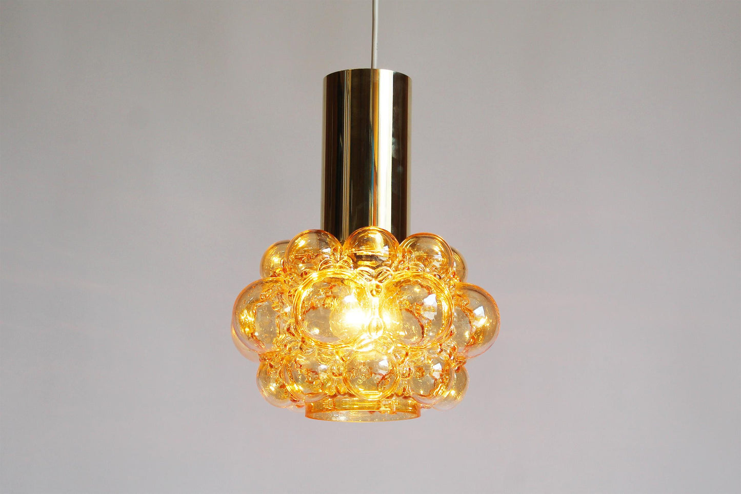 Amber glass pendant lamp by Helena Tynell for Glashutte Limburg